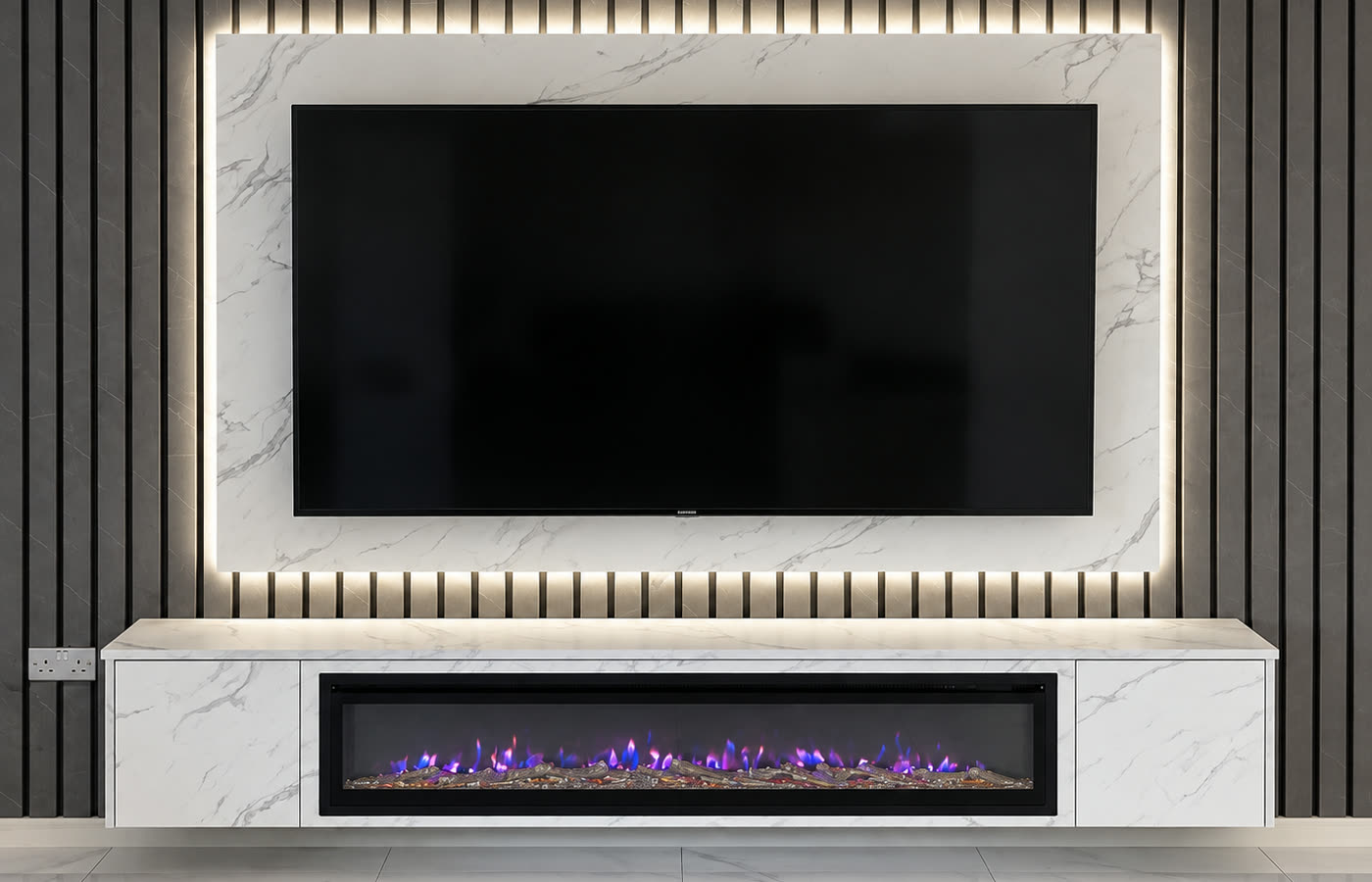 The finished wall: charcoal slat panelling, a backlit porcelain marble TV surround and a linear fire set into a floating marble unit